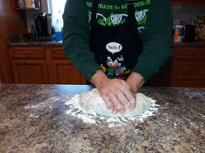 Kneading algae bread dough on a floured countertop (1)